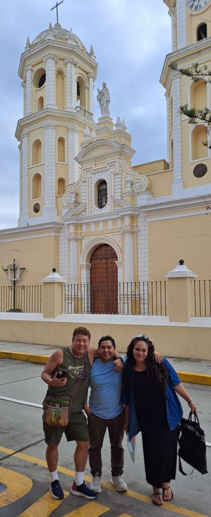 Photo of Daniel, German and Netita in front of the Lambayeque Cathedral