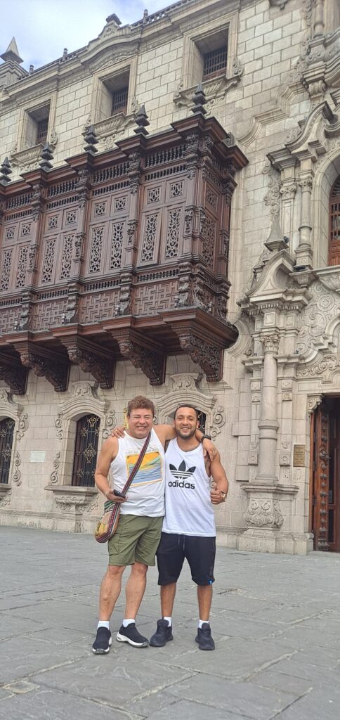 Photo of Daniel and Johnathon standing in front of the Archbishop's Palace