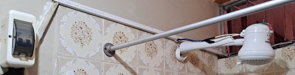 Photo of shower head with electric hot water heater